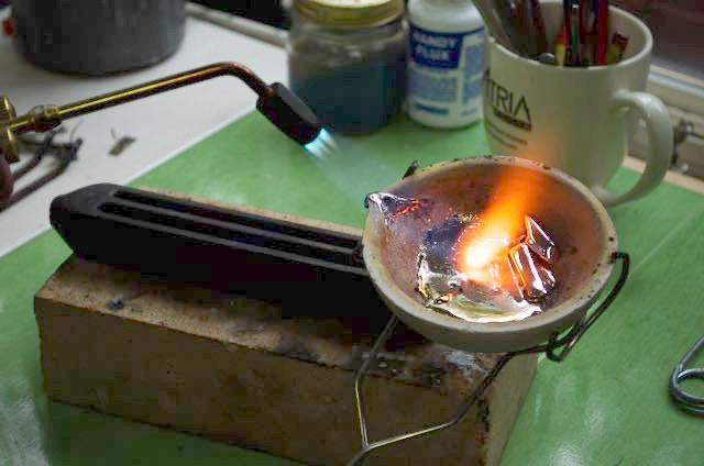 Metalsmith Jamie McLandsborough melts bismuth into a rod to make a metalpoint stylus